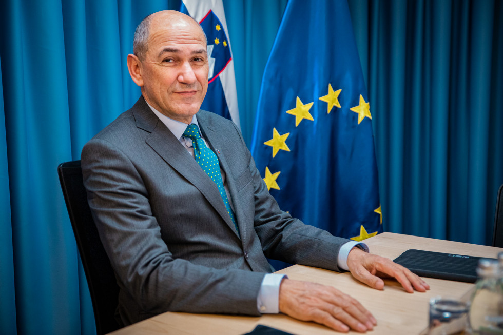 Prime Minister Janez Janša, Slovenian and EU flags.