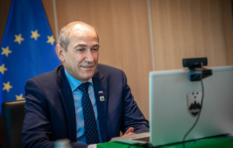 AVK Merkel2 (Prime Minister Janez Janša with a lap top in front of him.)