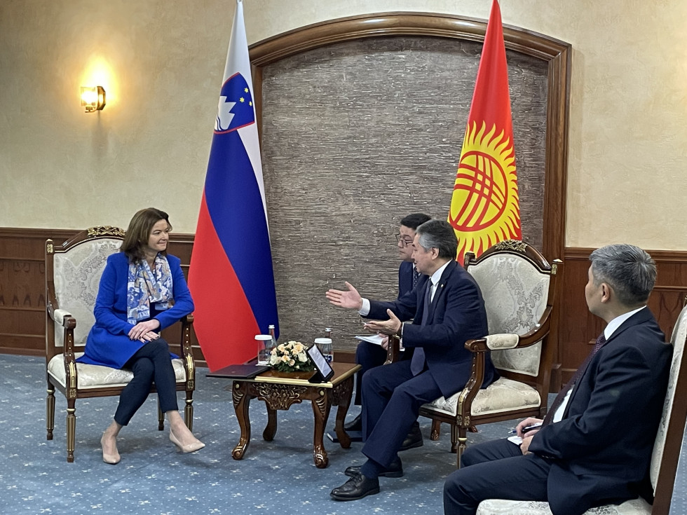 Minister Fajon and host Foreign Minister Zenbek Kulubaev sitting at the table