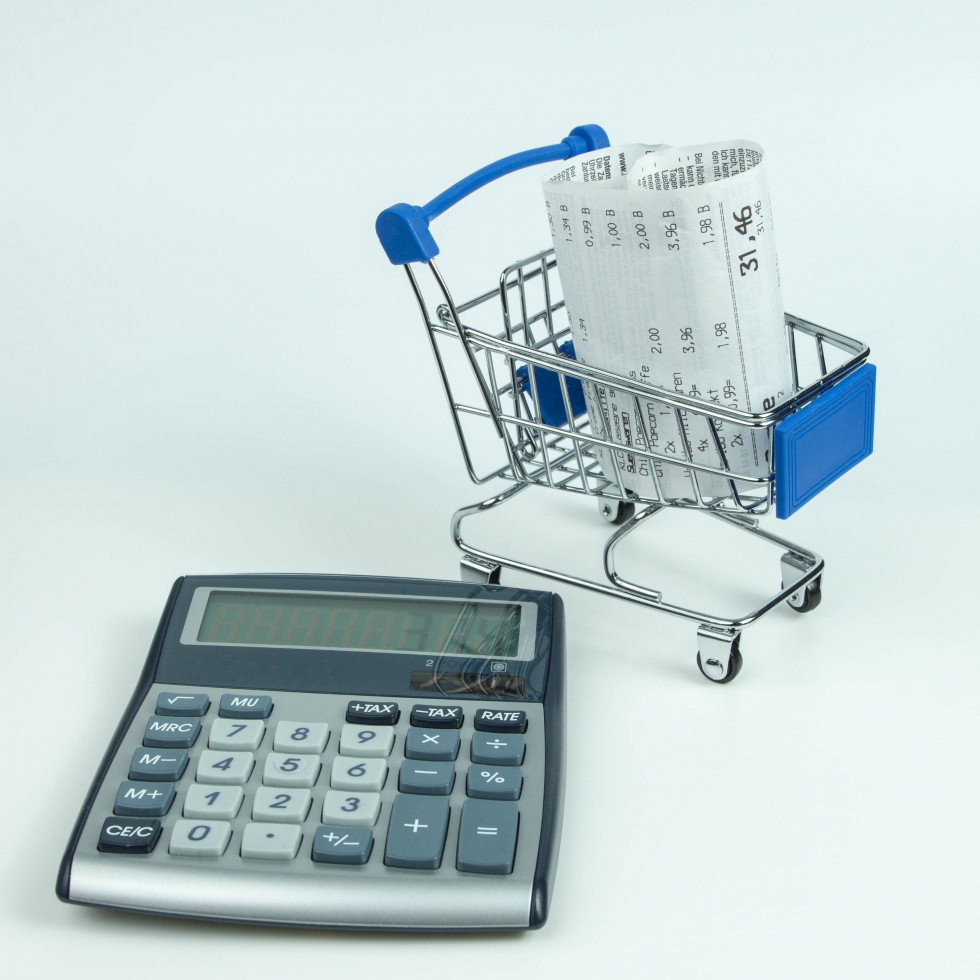 Calculator and receipt in the shopping cart.