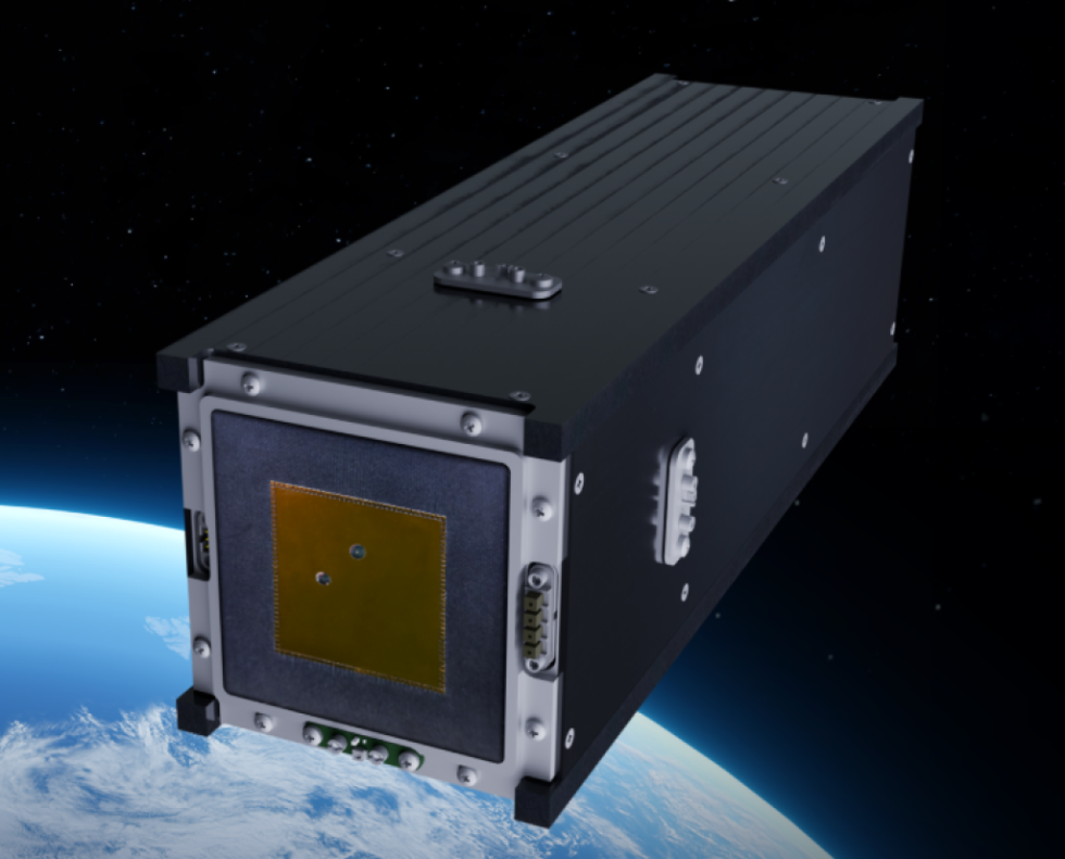 Satelit TRISAT-S in v ozadju delček Zemlje iz vesolja