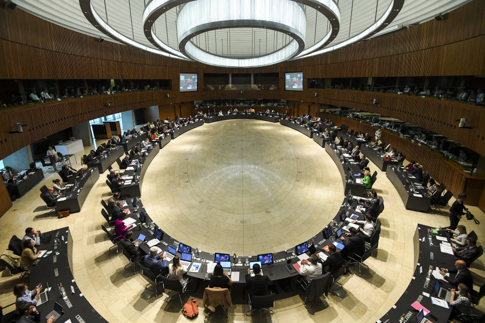 round table in large conference room with huge round white modern lights