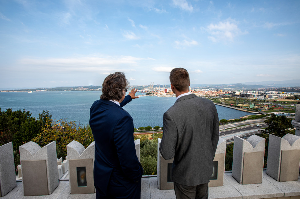 Businessmen looking towards Luka Koper