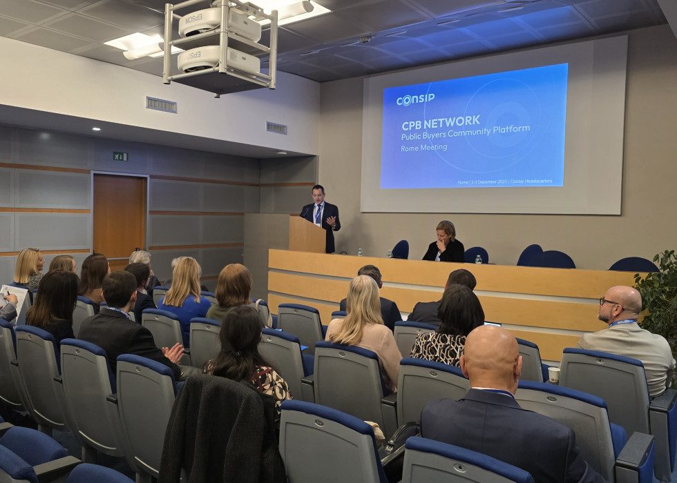 participants of the meeting sitting in the conference room