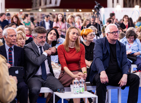 Director of the Slovenian Book Agency and State Secretary sit in the front row at the opening ceremony