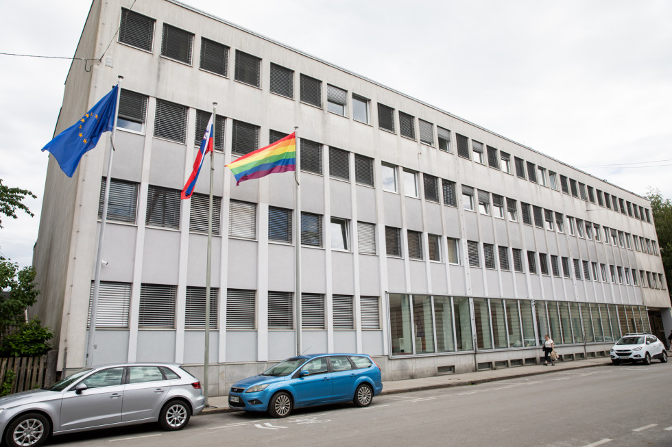 The flags of the European Union, Slovenia and LGBTIQ+ are flying in front of the building of the Ministry of Culture