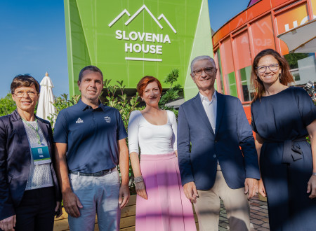 A group photo of five representatives of Slovenia, including the Minister of Culture and the President of the Olympic Committee of Slovenia.