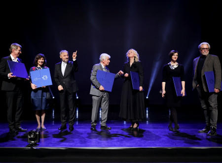 Group photo of Prešeren Laureates on the stage of Cankarjev dom