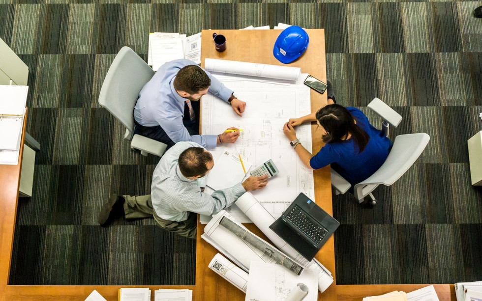 People sitting around the office desk