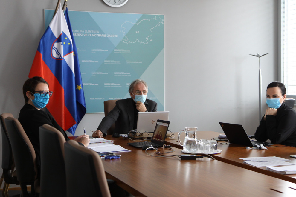 Minister Aleš Hojs with his co-workers attending the videoconference