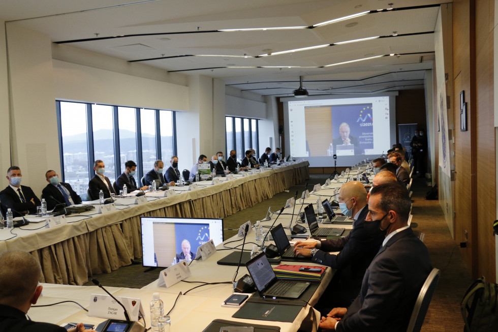 Conference participants sit at a table during the conference