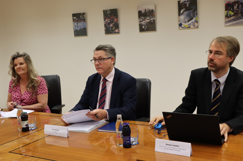 A group of anti-trafficking experts (Greta) are sitting at a table