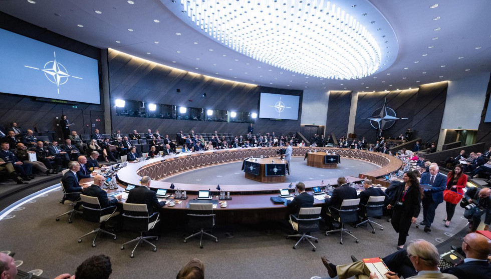 A conference hall with an oval table in the middle where the meeting was held.