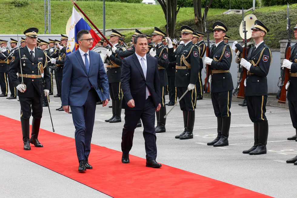 The two ministers walk the red carpet with the Slovenian Armed Forces (SAF) Guard of Honour