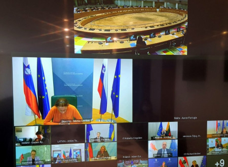 A photo of the screen showing the Secretary of State and at the same time footage of all the participating ministers