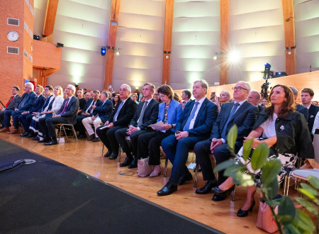 Address by CERN Director General Dr. Fabiola Gianotti. Guests from Slovenia in the audience.