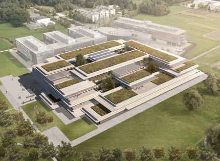 Zračni posnetek nove fakultete s terasastimi zelenimi strehami, umeščene v odprt prostor z bližnjimi objekti.