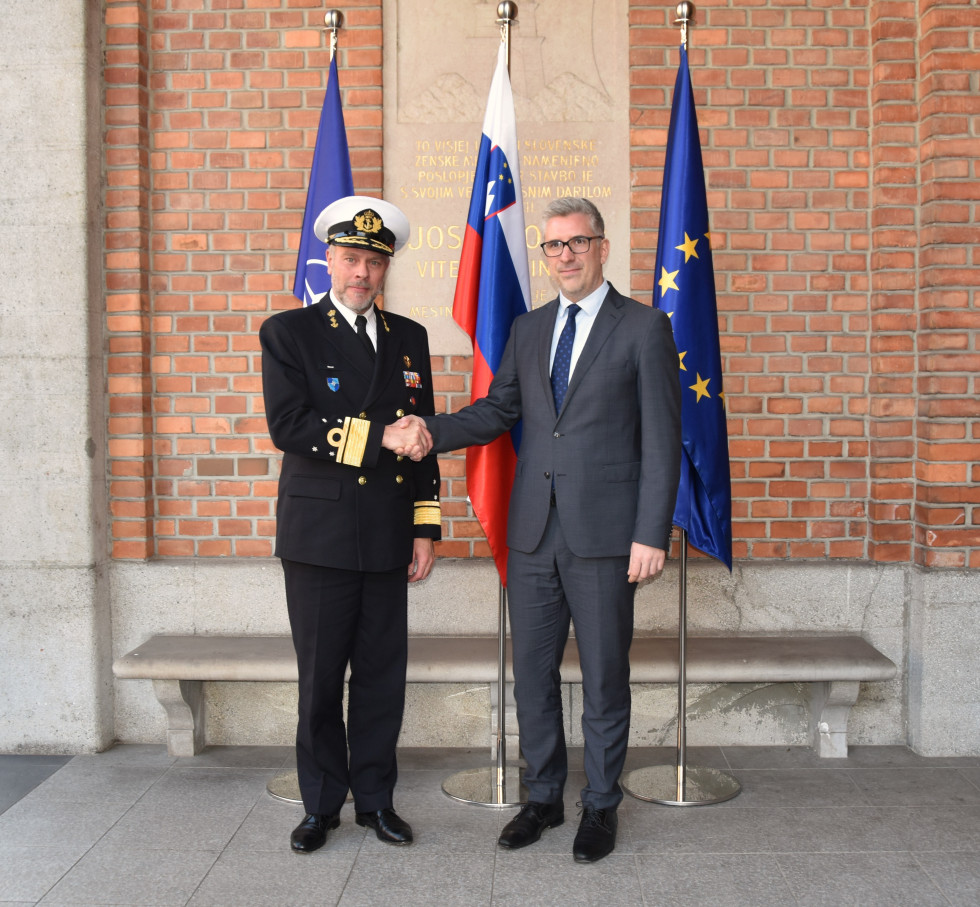 State Secretary Štucin shaking hands with Admiral Bauer during the handshake