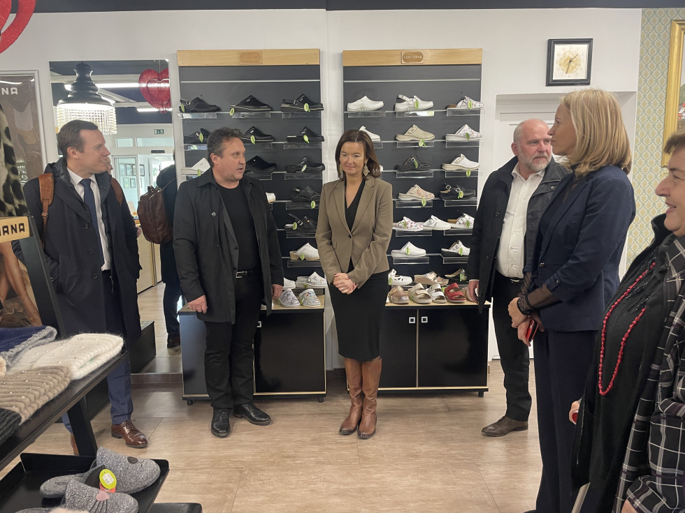 People standing in a shop with shoes