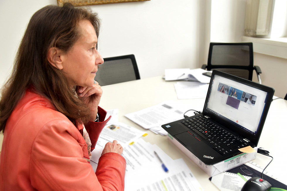 Director general is sitting in front of computer