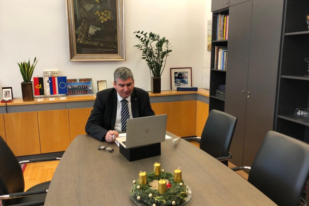 State Secretary Raščan sitting at his desk, computer in front of him