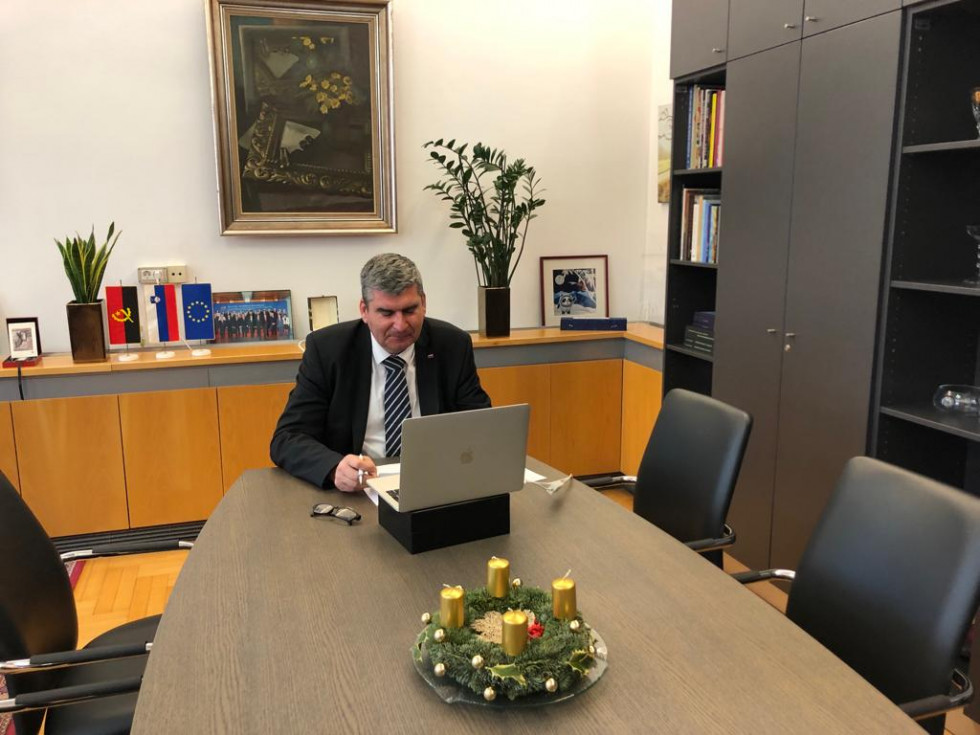 State Secretary Raščan sitting at his desk, computer in front of him