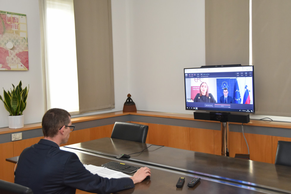 sitting with computer screen