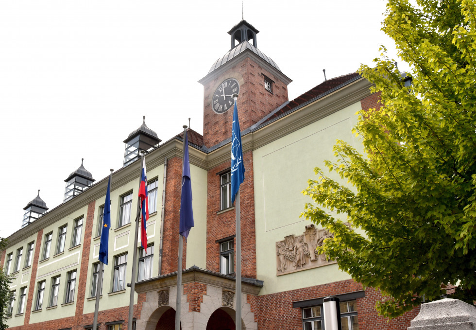  flags on a pole in front of the ministry building