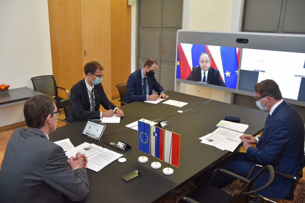 at the table with screen at the end, flags on table