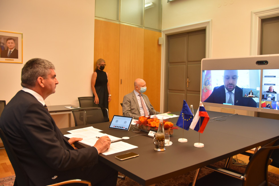 sitting at the table, big screen