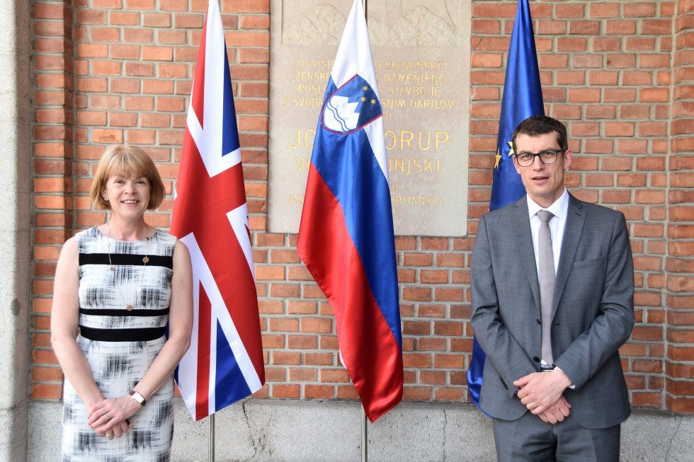 standing with flags behind