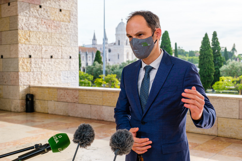 during press statement with microphones, outdoor