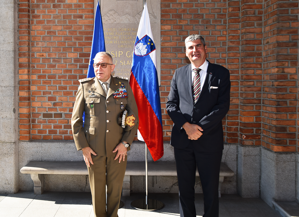 standing in front of flags