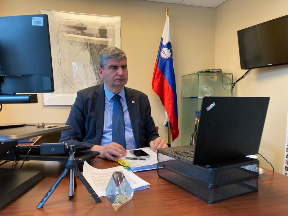 State Secretary Dr Stanislav Raščan sitting in front of the computer