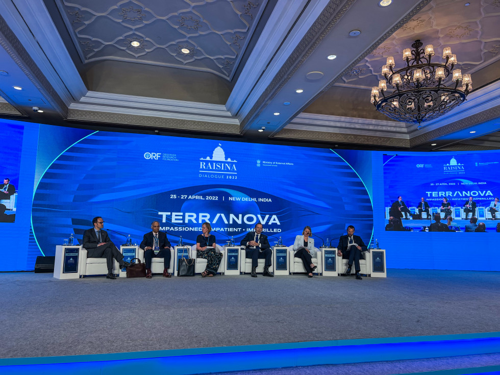 hall, chairs set on stage, panelists sitting