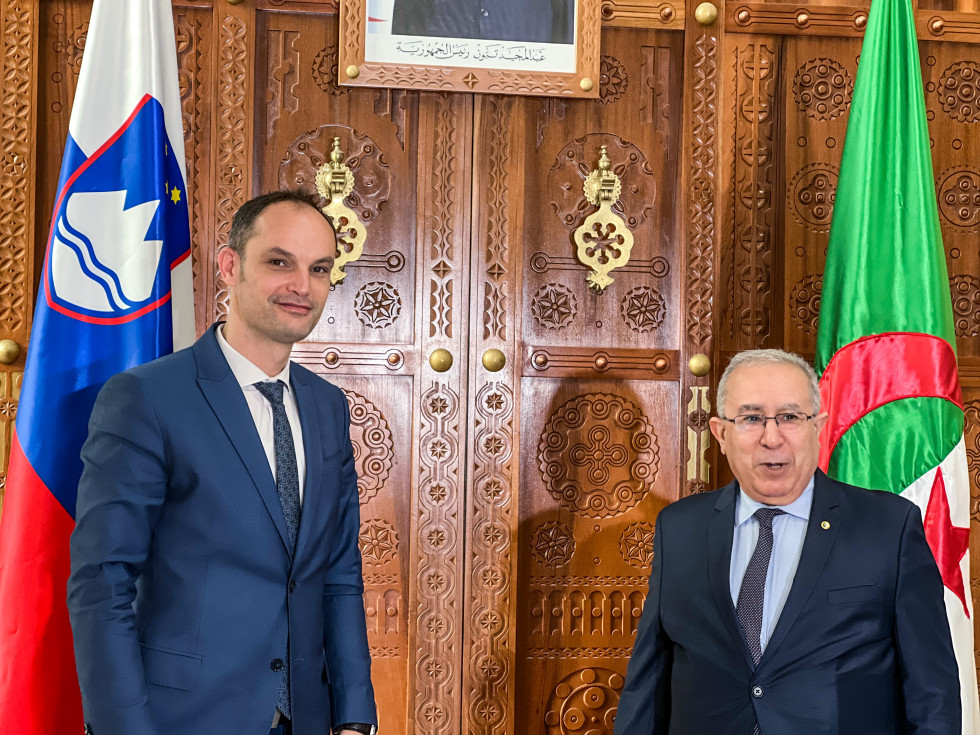 ministers standing in front of flags