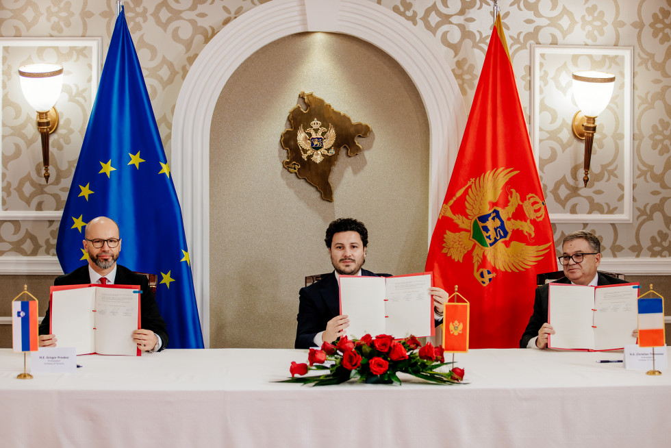 Representatives of the three ministries after signing the letter