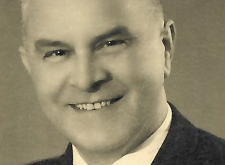 Mirko Černič smiling in a suit.