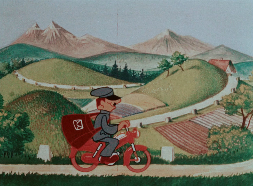 Poštar na rdečem motorju Tomos.