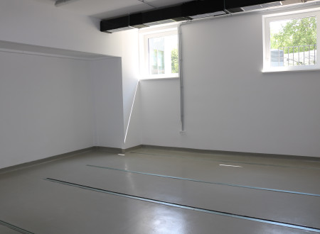 The floor shows notches for mobile archive shelving, also known as compacts. 