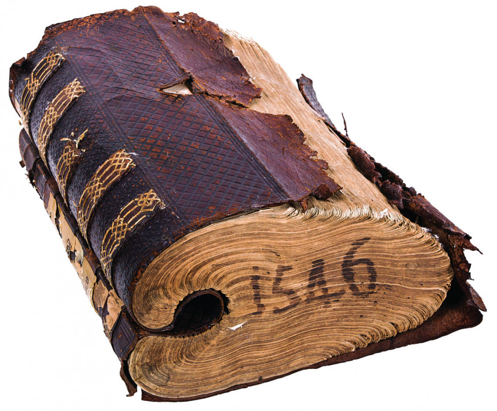 Leather bound book. The back of the bookblock curls into the center of the book. The book was published between 1546 and 1549. 