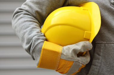 Work helmet in hand