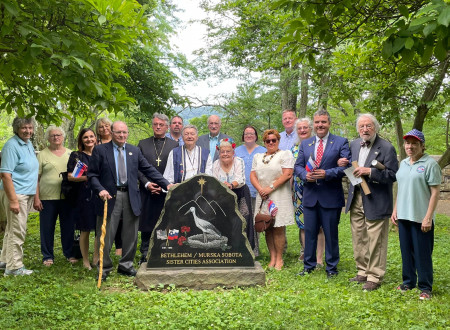 A memorial photo by the Friendship Monument, erected on the 20th anniversary of the sister cities