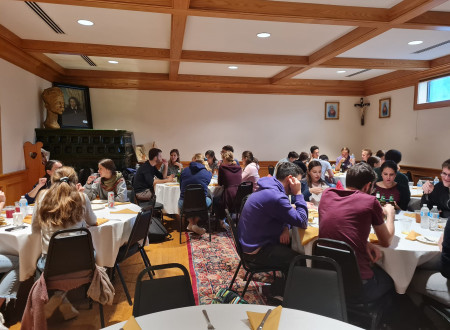 Choir members eating after the concert