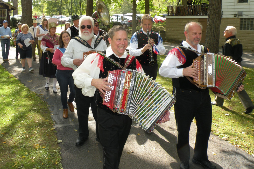 A parade of musicians and people in folk costumes