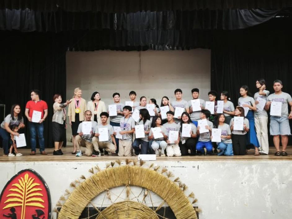 High-level guests and youth attending the final stage of an innovative youth advocacy initiative: "Pasundayag: Mindanao Street Theatre for Sustainable Peace"