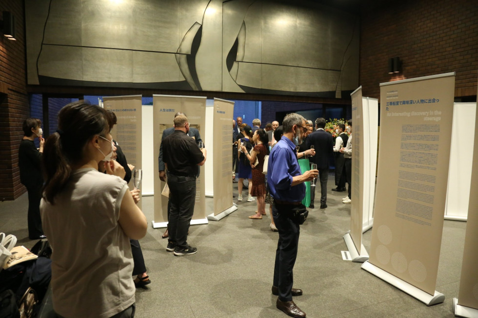 Guests are observing the panels of the exhibition