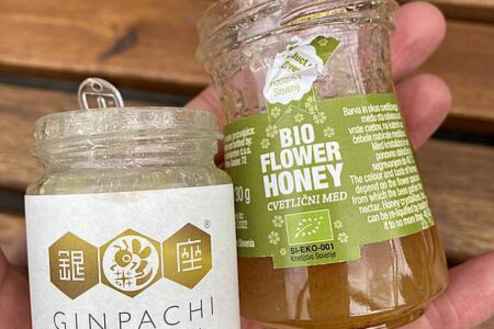 Open jars of Japanese and Slovenian honey for honey tasting