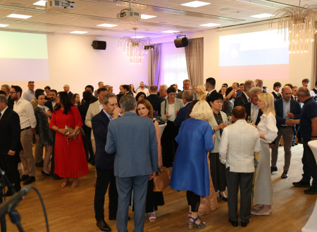 Guests socialising at the reception celebrating Slovenia’s Statehood Day.