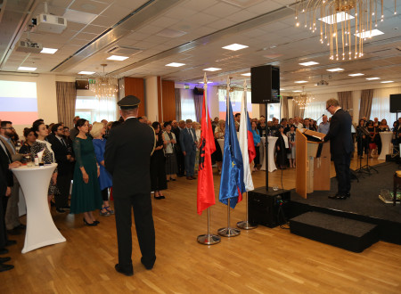 Guests listen to the address by the Ambassador of the Republic of Slovenia.